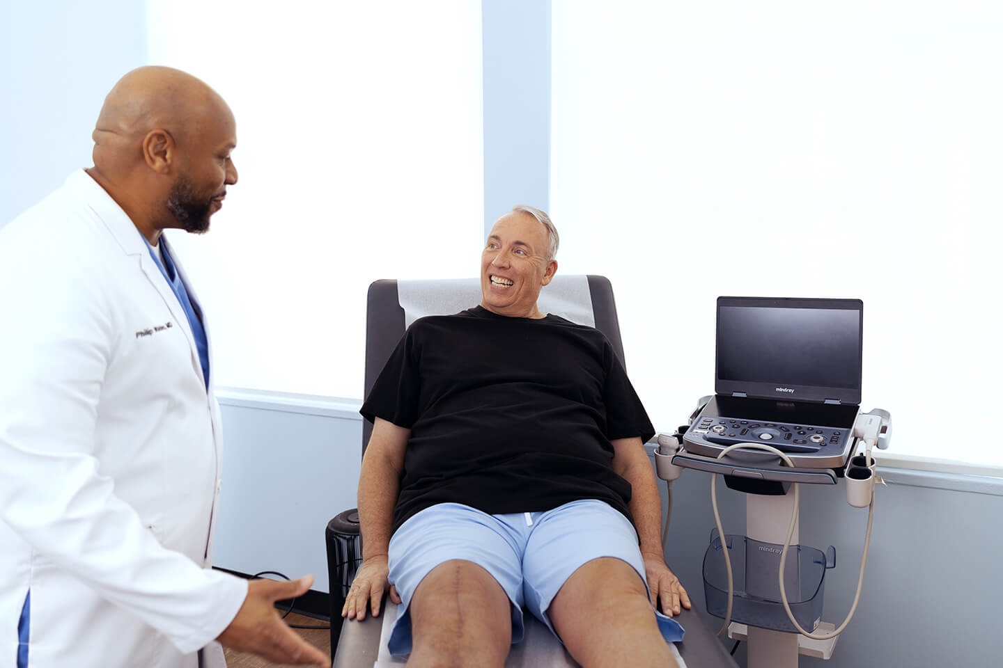 Man at a varicose vein evaluation with a vein specialist