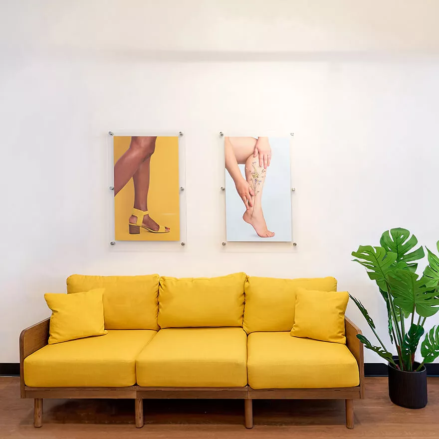 The couch and artwork in the waiting room of our vein clinic.